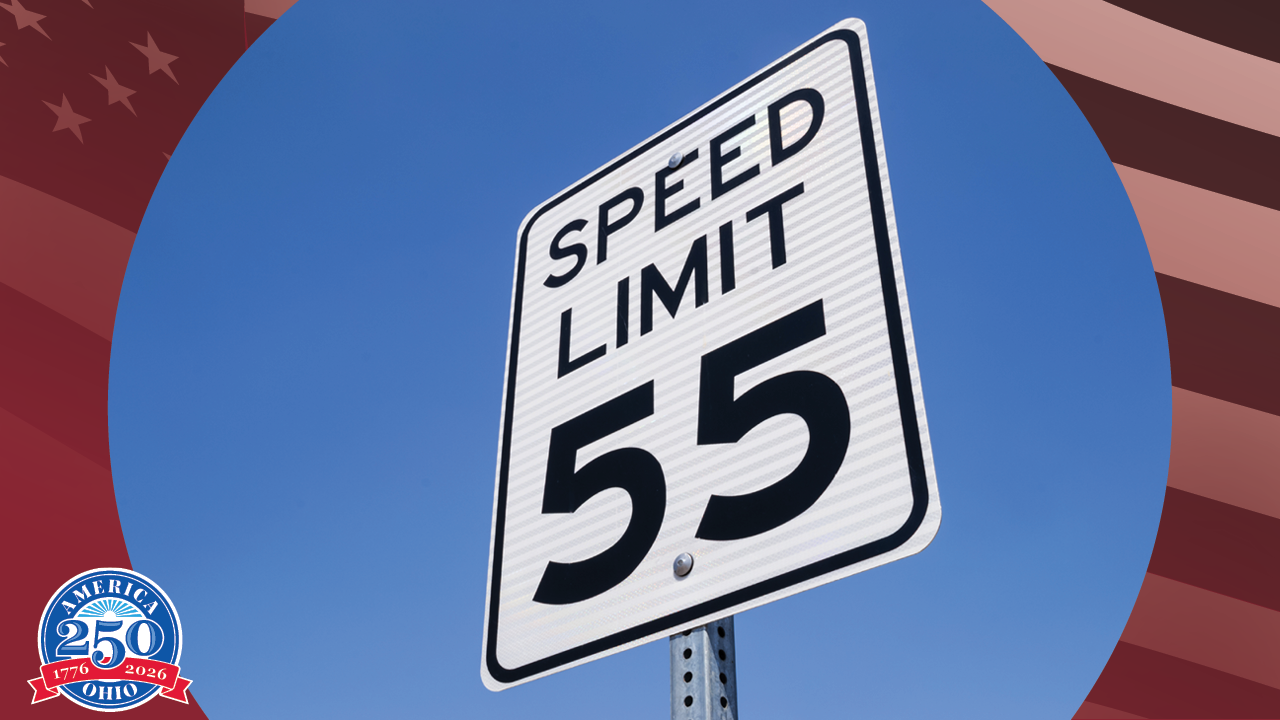road sign with large text reading speed limit 55
