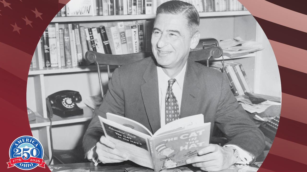 historic photo of Doctor Seuss sitting in his office