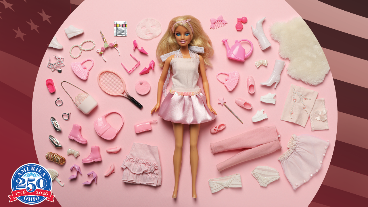 a Barbie doll surrouned by it's accessories