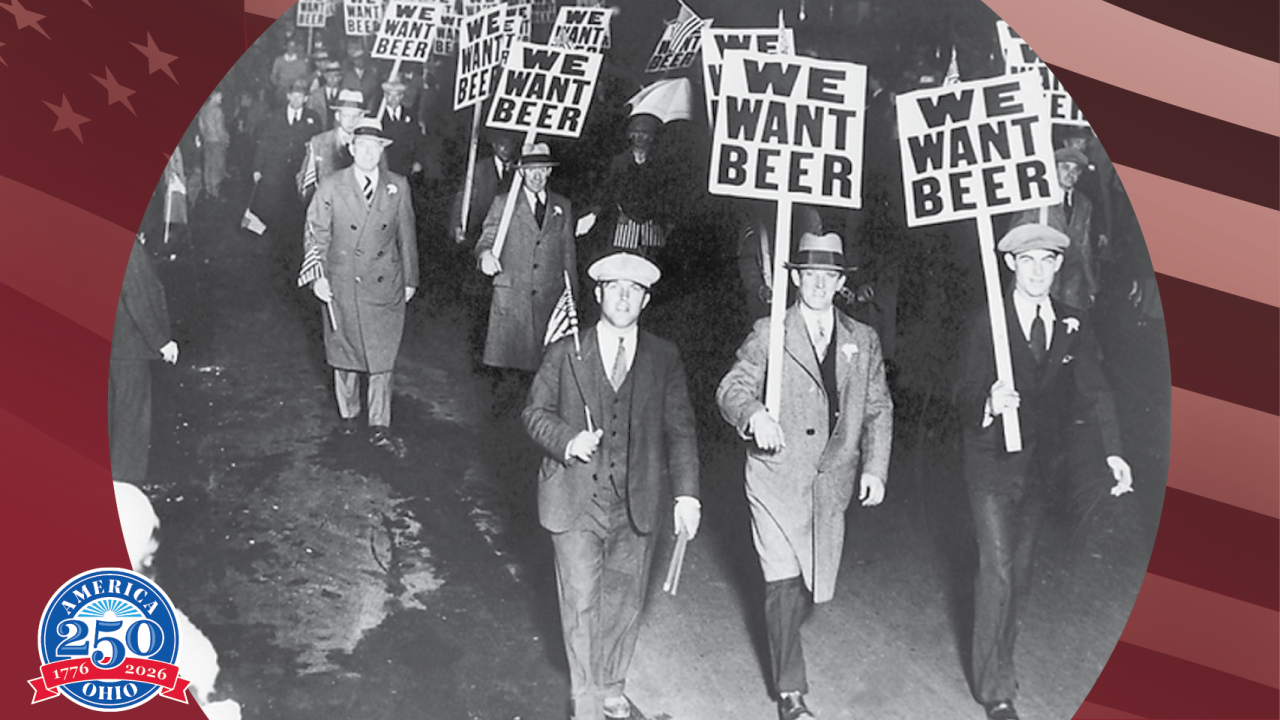 Historic photo of men marching with we want beer signs