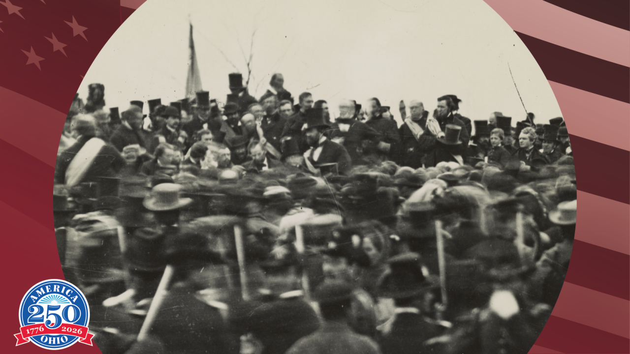 Historic photo showing a crowd of people listening to President Lincoln giving the Gettysburg address