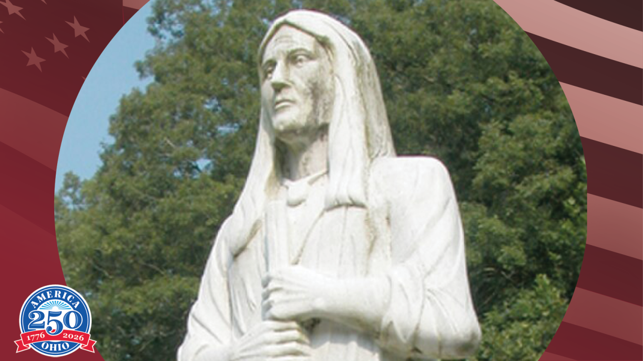 Statue of Chief Logan with trees in the background
