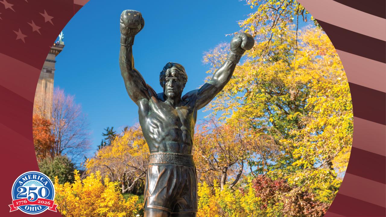 Statue of Rocky Balboa with arms raised in victory