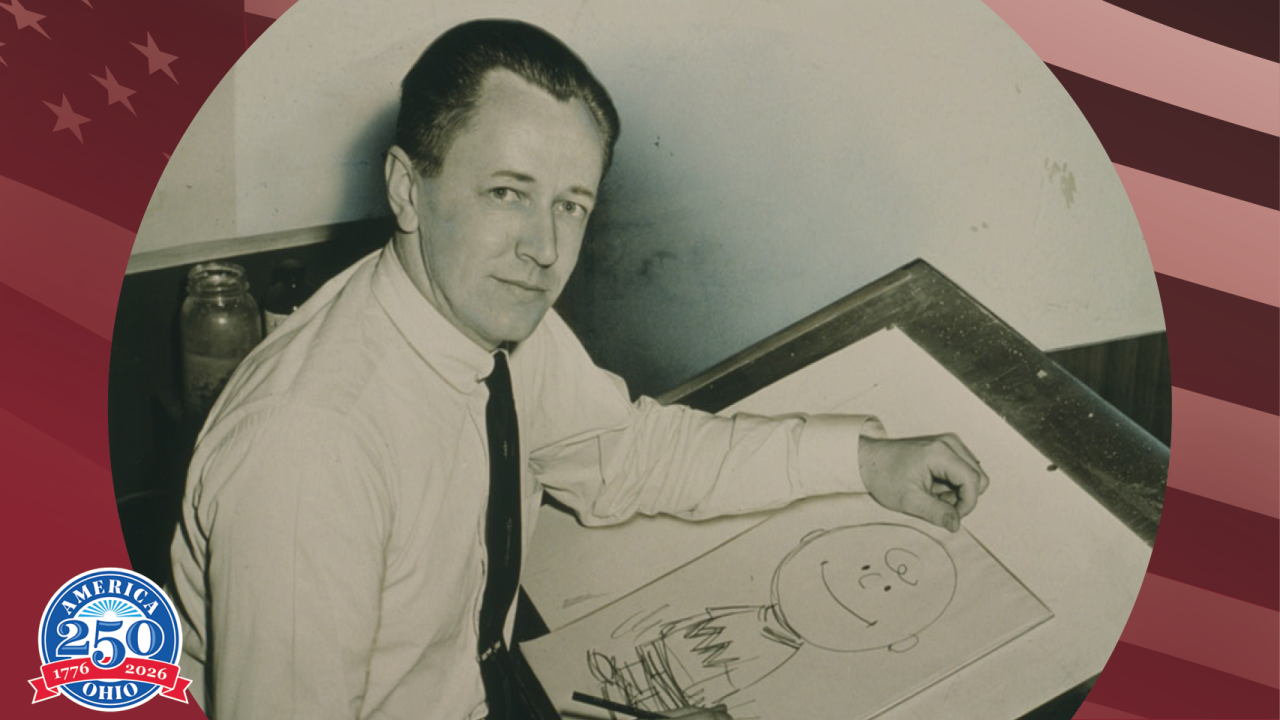 Historic photo of Charles Schulz drawing Charlie Brown
