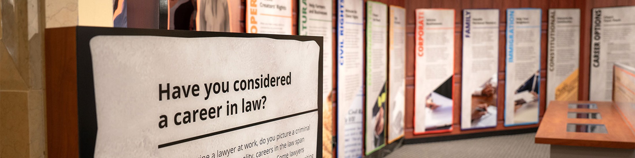 Wall sign that reads have you considered a career in law