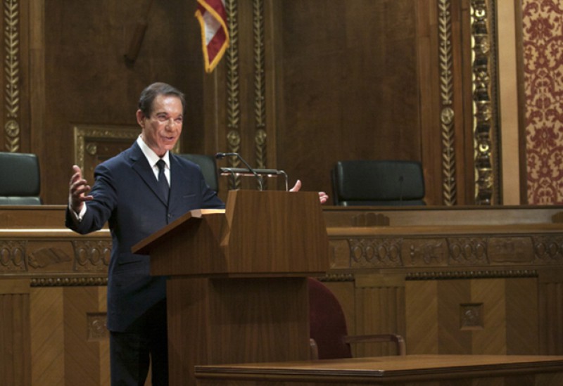 Image of Avery Friedman speaking from behind a podium in the courtroom of the Thomas J. Moyer Ohio Judicial Center