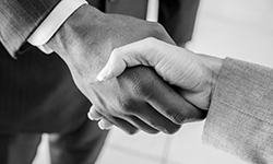 Image of two men shaking hands